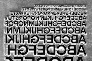 <p>Proofing and testing sizes of Modern Gothic on a magnesium engraving plate, 2021.</p>